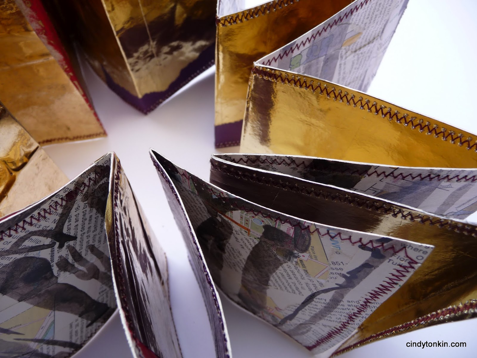 Concertina from collaged paris maps with gold backing